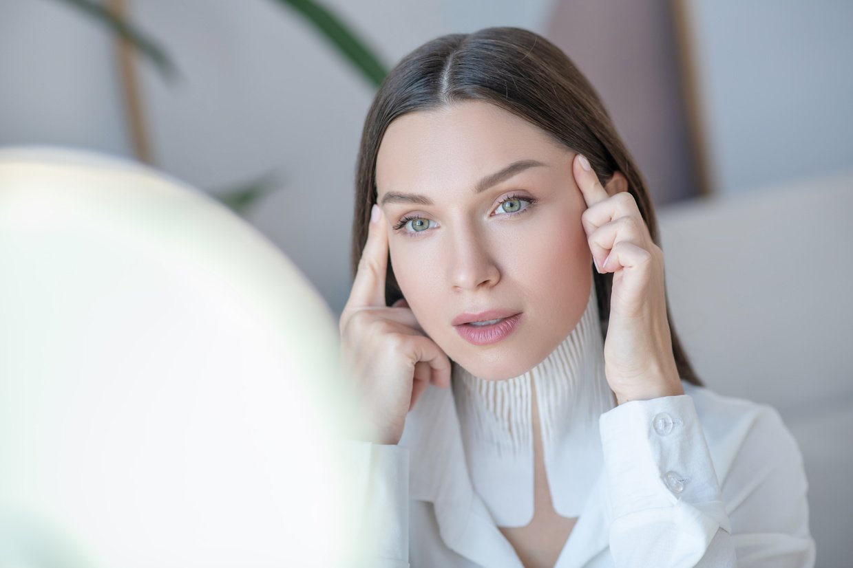 Beautiful Woman Applying an Anti-Wrinkle Facial Massage